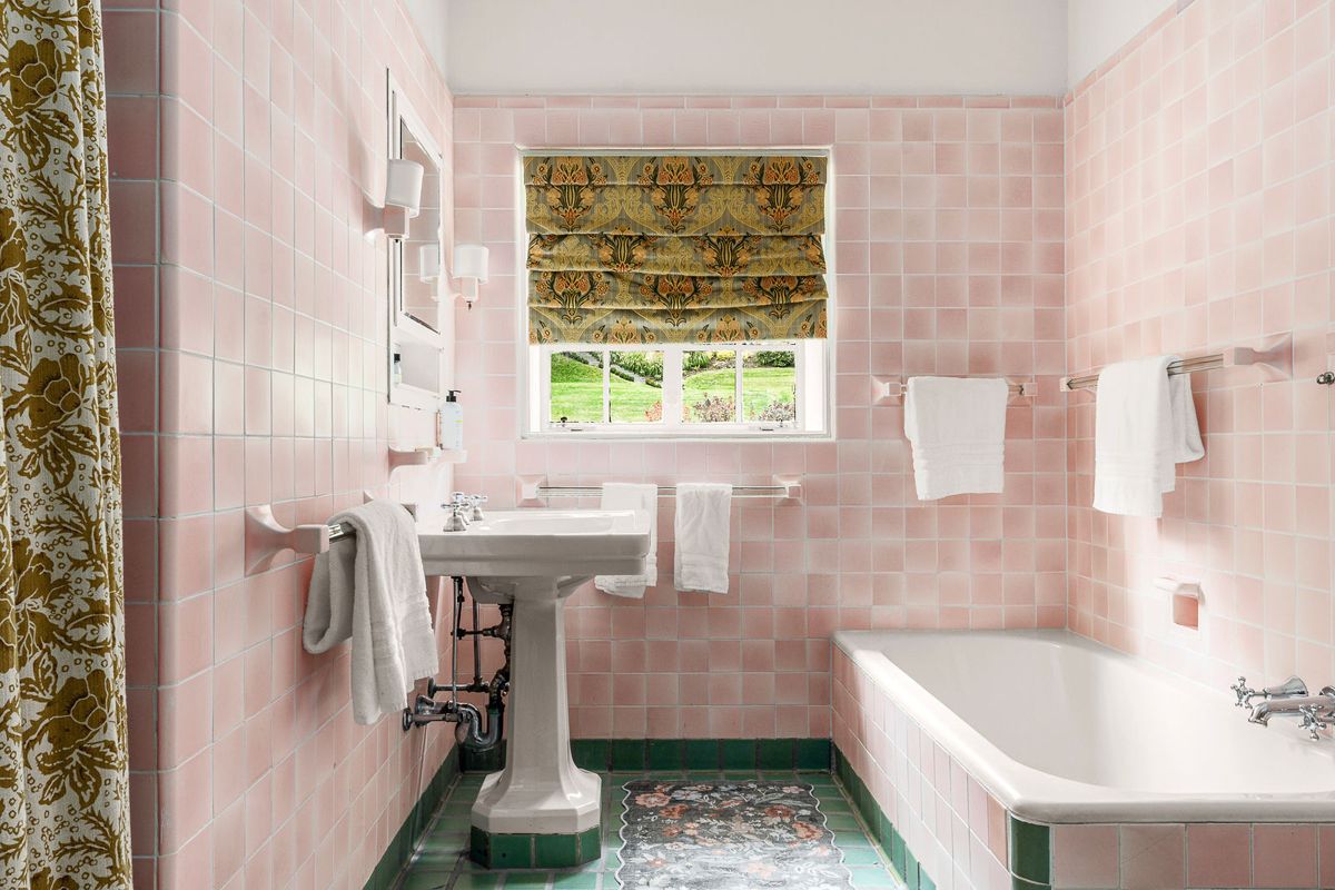 Period bath with tiled walls and pedestal sink at 184 Upper Mountain Avenue