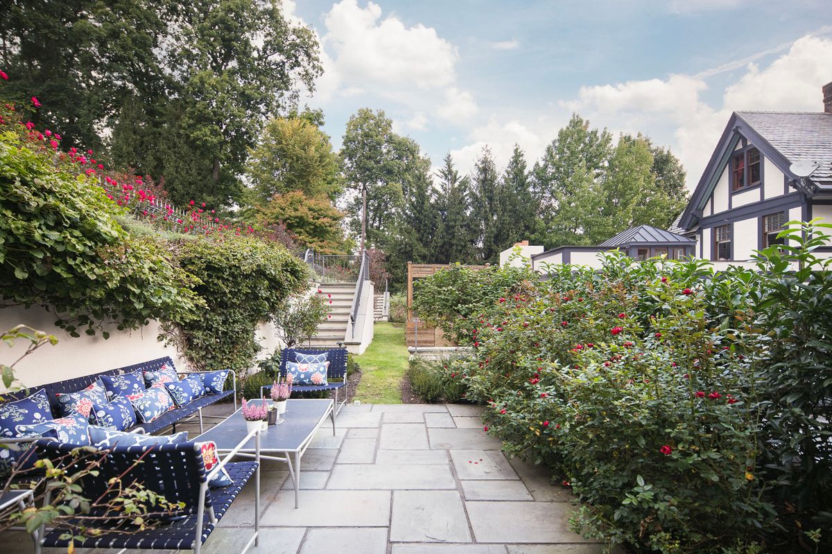 Garden terrace with lounge seating at 184 Upper Mountain Avenue