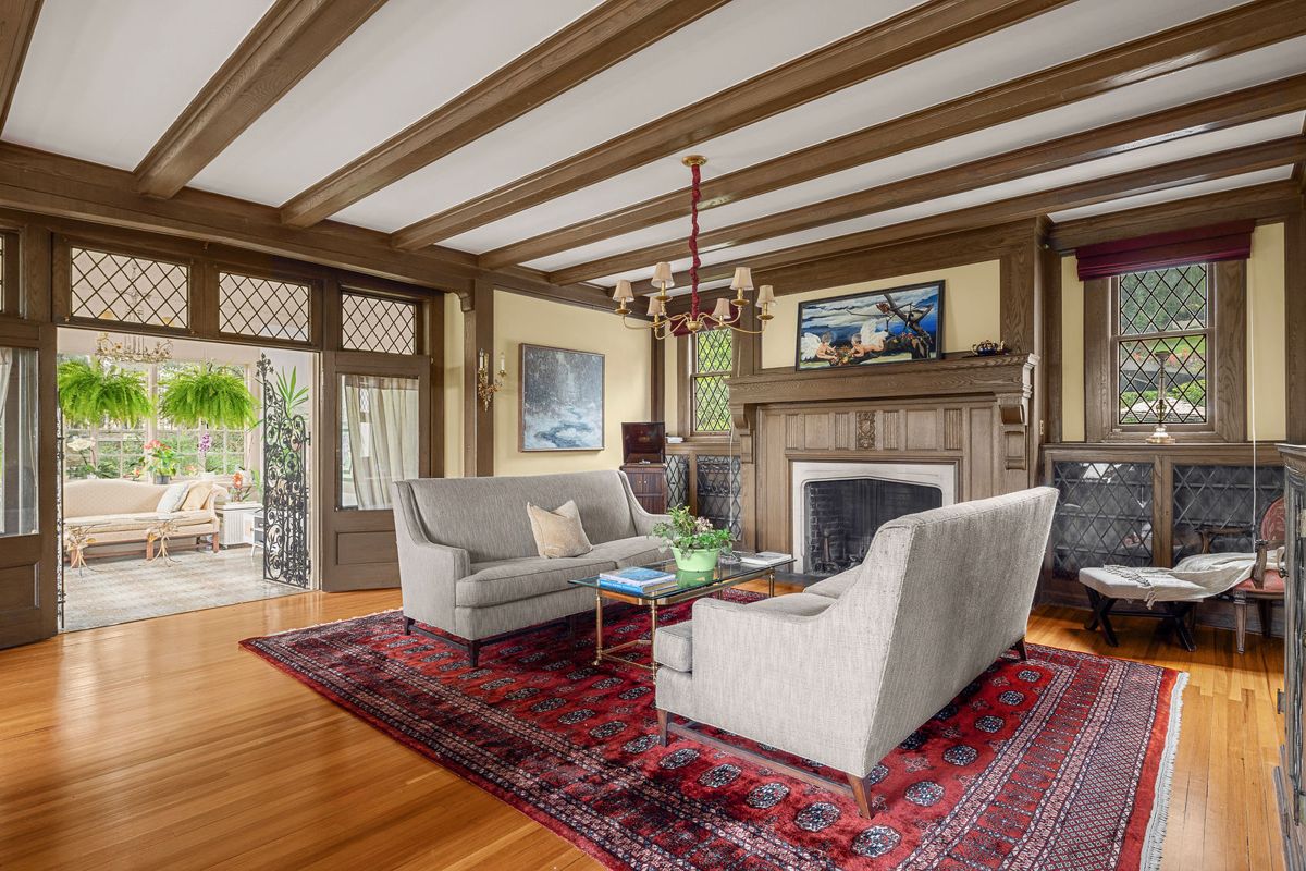 Living room with beamed ceiling, fireplace and leaded windows at 184 Upper Mountain Avenue
