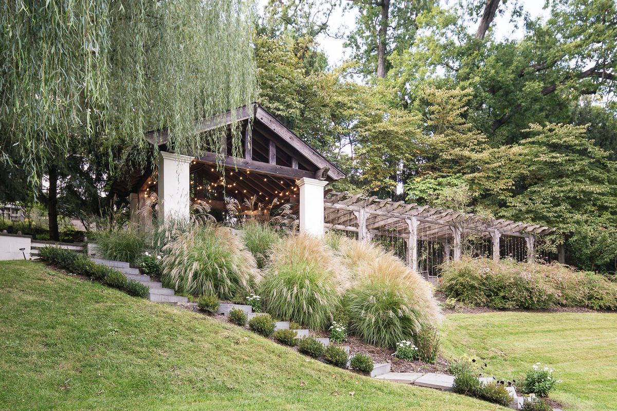 The cedar pergola and slate roofed loggia above the lawn at 184 Upper Mountain Avenue