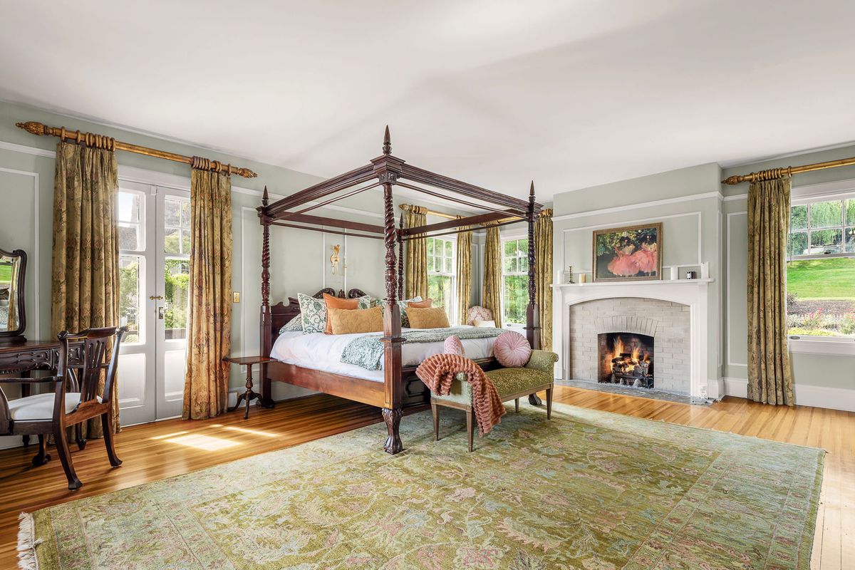 The primary bedroom fireplace and seating area at 184 Upper Mountain Avenue