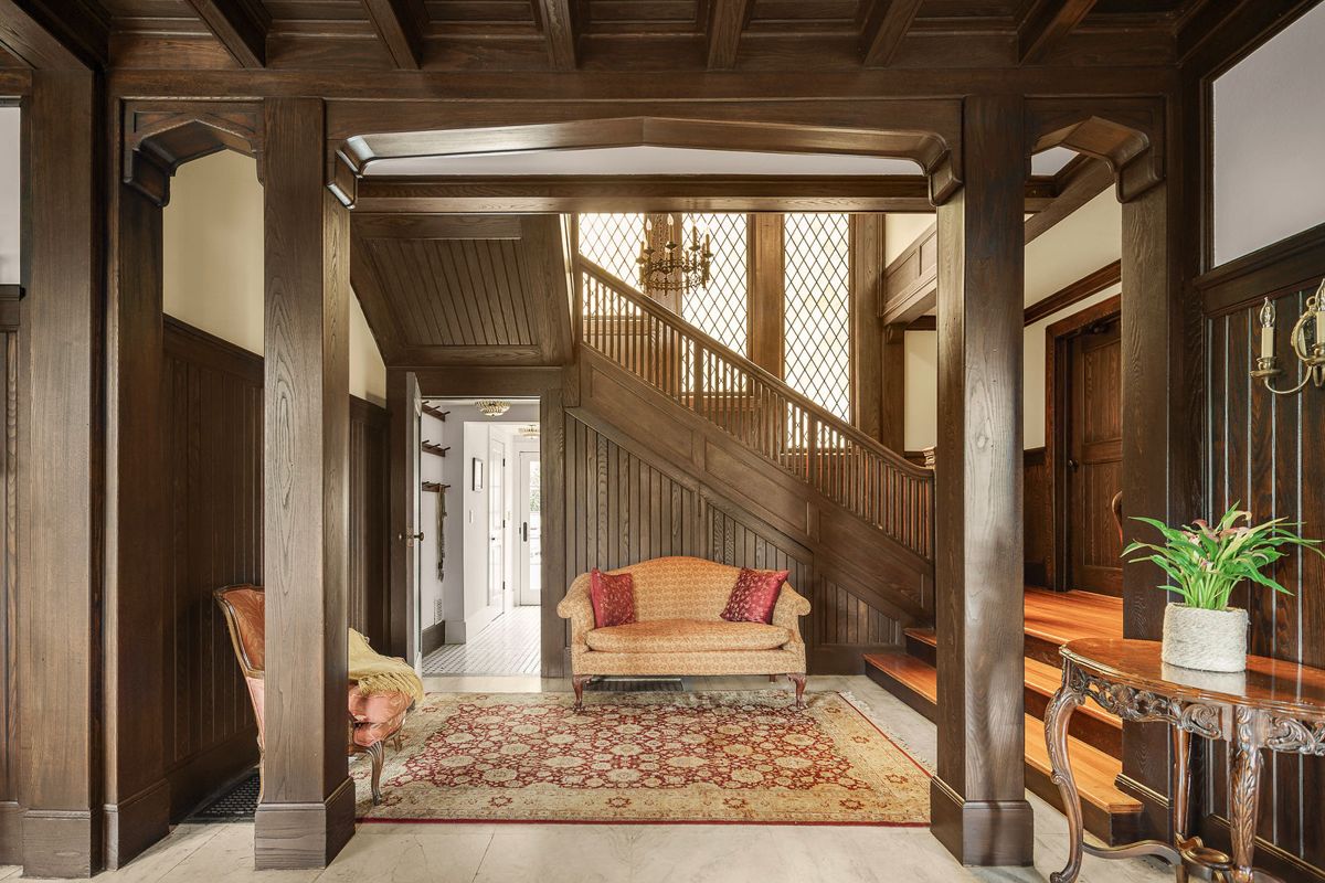Carved wood staircase rising from the hall at 184 Upper Mountain Avenue